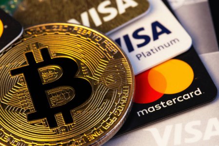 Photo for Visa and MasterCard logo on plastic electronic cards with bitcoin cryptocurrency closeup. Visa, MasterCard worldwide is an American multinational financial services corporation. Batumi, Georgia - October 6, 2022 - Royalty Free Image