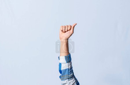 Photo for Hand gesturing the letter A in sign language on isolated background. Man hand gesturing the letter A of the alphabet isolated. Letters of the alphabet in sign language. - Royalty Free Image