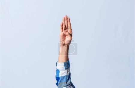 Photo for Hand gesturing the letter B in sign language on isolated background. Man hand gesturing the letter B of the alphabet isolated. Letters of the alphabet in sign language - Royalty Free Image