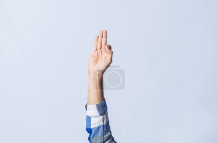 Photo for Hand gesturing the letter F in sign language on isolated background. Man hand gesturing the letter F of the alphabet isolated. Letters of the alphabet in sign language - Royalty Free Image