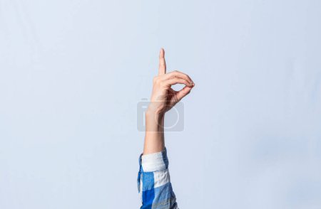 Photo for Hand gesturing the letter D in sign language on isolated background. Man hand gesturing the letter D of the alphabet isolated. Letters of the alphabet in sign language - Royalty Free Image