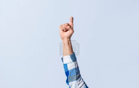 Photo for Hand gesturing the letter Z in sign language on an isolated background. Man's hand gesturing the letter Z of the alphabet isolated. Letter Z of the alphabet in sign language - Royalty Free Image