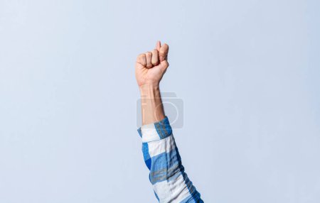 Photo for Hand gesturing the letter T in sign language on an isolated background. Man's hand gesturing the letter T of the alphabet isolated. Letter T of the alphabet in sign language - Royalty Free Image