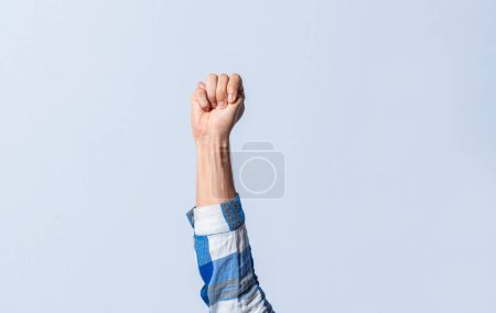 Photo for Hand gesturing the letter M in sign language on an isolated background. Man's hand gesturing the letter M of the alphabet isolated. Letter M of the alphabet in sign language - Royalty Free Image