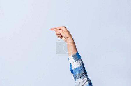 Photo for Hand gesturing the letter G in sign language on an isolated background. Man's hand gesturing the letter G of the alphabet isolated. Letters of the alphabet in sign language - Royalty Free Image