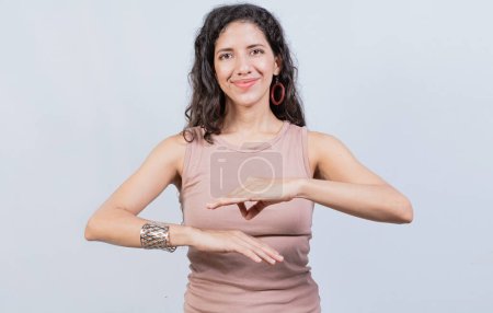 Photo for Smiling young woman gesturing in sign language. Female interpreter gesturing in sign language, People gesturing in sign language isolated - Royalty Free Image