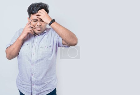 Photo for Exhausted person putting the palm of his hand on his face. Fatigued and exhausted man isolated. Concept of a bored and tired man - Royalty Free Image
