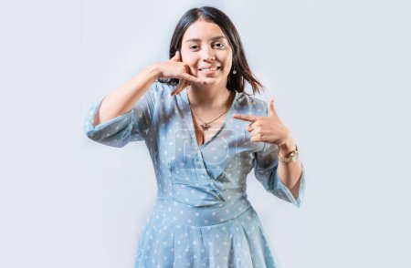 Photo for Young woman gesturing CALL ME in sign language isolated. Manual gestures of people with hearing problems - Royalty Free Image
