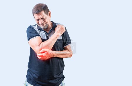 Photo for Elderly man suffering from elbow pain. Concept of Elbow Arthritis. Mature man with elbow pain isolated - Royalty Free Image