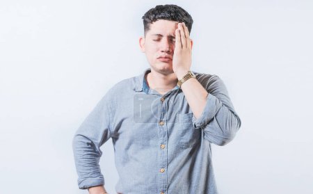 Exhausted person putting the palm of his hand on his face. Tired and exhausted man covering his face with the palm hand