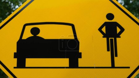 Photo for Share the road traffic sign. Black car and cyclist on the yellow background. - Royalty Free Image