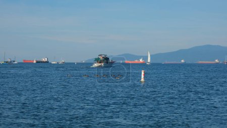 Photo for Boats in the harbor on a beautiful sunny day. Luxury yachts and large ships. - Royalty Free Image