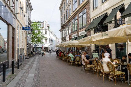 Photo for Copenhagen, Denmark - May 31, 2023: People sitting outside the pastry shop La Glace in the historic city centre. - Royalty Free Image