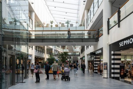 Photo for Copenhagen, Denmark - June 30, 2023: People inside the shopping mall Frederiksberg Centret. - Royalty Free Image