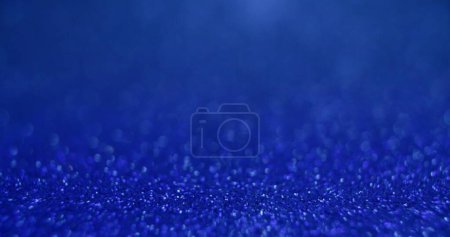 Photo for Bokeh light texture. Placement background. Sequin glare. Defocused blue color glowing round sparkles texture on abstract empty space wallpaper. - Royalty Free Image