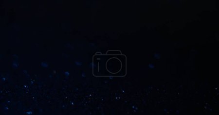 Photo for Blur sparkles texture. Bokeh light background. Abyss glow. Defocused blue color shiny particles radiance on dark black abstract copy space wallpaper. - Royalty Free Image