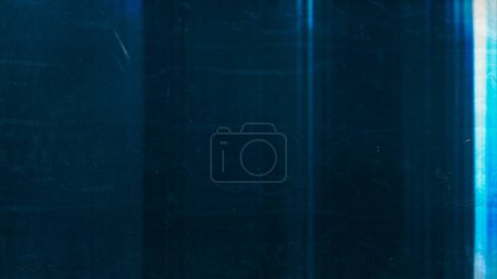 Foto de Distressed overlay. Dust scratch texture. Light flare noise. Blue white glow smeared wet stains on dark weathered abstract empty space background. - Imagen libre de derechos