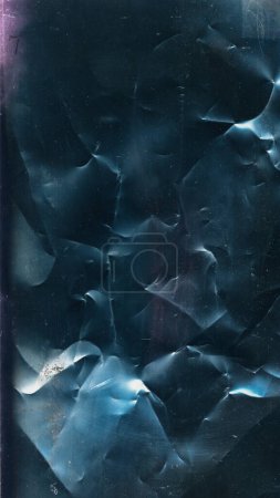 Photo for Crumpled texture. Old film noise. Creased paper overlay. Pink blue color light flare dust scratches on dark black weathered grunge abstract background. - Royalty Free Image