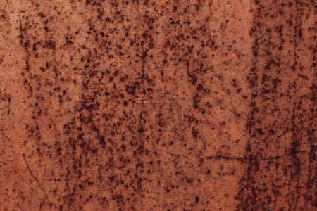 Foto de Rusty background. Iron texture. Macro shooting. Closeup rough red brown material with light corrosion effect. - Imagen libre de derechos