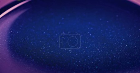 Téléchargez les photos : Blur glitter overlay. Color bokeh glow. Cosmic star dust. Defocused neon blue pink color light flare shiny grain texture futuristic abstract background with free space. - en image libre de droit