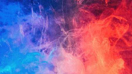 Photo for Color smoke abstract background. Cold hot. Ice fire flame. Defocused blue red contrast paint splash light glowing vapor floating cloud texture. - Royalty Free Image
