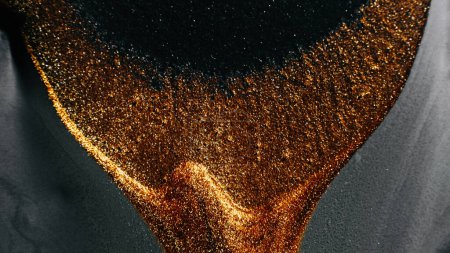Photo for Glitter fluid. Abstract background. Sparkling wave. Defocused shimmering metallic bronze gold silver gray black color liquid paint grain texture. - Royalty Free Image
