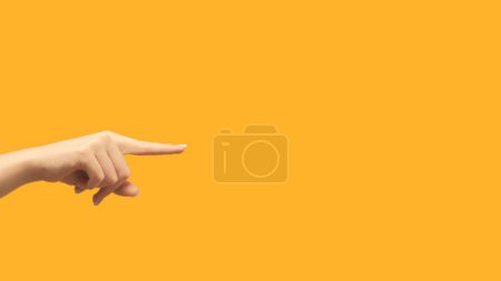 Foto de Finger pointing. Advertising background. Offer promotion. Female hand showing recommending something invisible on orange copy space. - Imagen libre de derechos