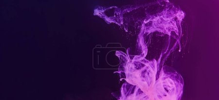 Foto de Color smoke neon background. Paint splash. Pink purple gradient glowing ink water haze cloud floating on dark abstract copy space. - Imagen libre de derechos