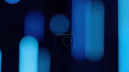 Foto de Bokeh glow. Neon light flare. Luminous rays leak. Defocused fluorescent blue color flecks on dark black abstract free space background. - Imagen libre de derechos