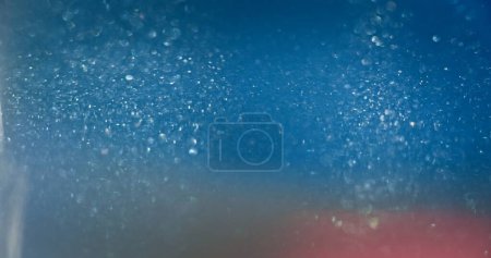 Foto de Bokeh light overlay. Blur glitter texture. Shiny bubbles. Defocused neon blue pink color gradient lens flare glow abstract background with free space. - Imagen libre de derechos