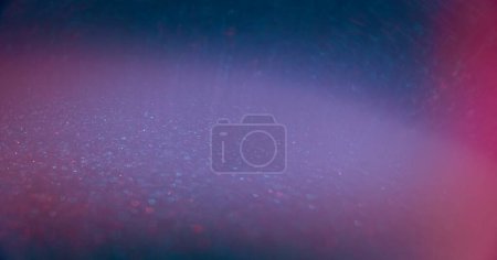 Photo for Blur glitter glow. Bokeh light overlay. Glamour shimmering gleam. Defocused neon blue pink color flare sparkles texture abstract copy space background. - Royalty Free Image
