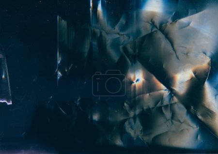 Foto de Grunge overlay. Distressed film. Crushed foil texture. Blue orange flare dust scratches noise on dark wrinkled aged abstract illustration background. - Imagen libre de derechos