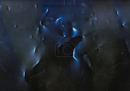 Foto de Grunge overlay. Distressed film. Crushed foil texture. Blue orange flare dust scratches noise on dark black wrinkled aged abstract illustration background. - Imagen libre de derechos
