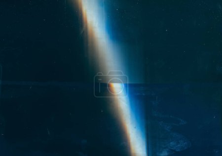 Photo for Retro overlay. Old film. Distressed screen. Blue orange light flare stains dust scratches on dark weathered illustration abstract background. - Royalty Free Image