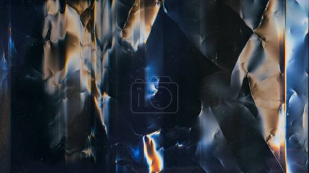 Photo for Crushed texture. Distressed film. Grunge overlay. Blue orange color light flare dust scratches noise on dark black wrinkled used abstract illustration background. - Royalty Free Image