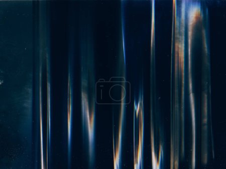 Photo for Distressed film. Noise overlay. Light flare. Blue orange color defect stains dust scratches texture on dark black illustration abstract background. - Royalty Free Image