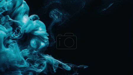 Photo for Paint drop. Ink water. Smoke cloud. Fluid blob. Blue color glowing shiny vapor splash on black abstract art background with empty space. - Royalty Free Image