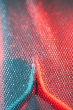 Photo for Please help. Rescue salvation. Red blue color bokeh light defocused female prayer folded hands behind transparent plastic bubble wrap textured free space background. - Royalty Free Image