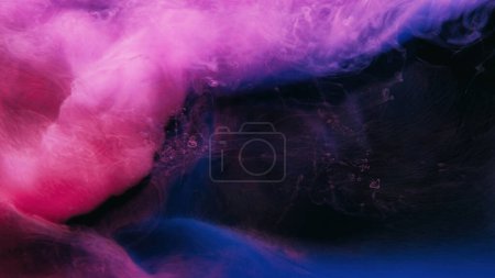 Photo for Neon smoke. Paint water. Vapor wave. Dreamlike cloud. Bright pink blue purple color haze flow on dark black abstract copy space background. - Royalty Free Image