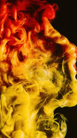 Photo for Paint splash. Ink water. Fluid mix. Hot burst. Bright red yellow orange color gradient vapor cloud on dark black abstract background. - Royalty Free Image