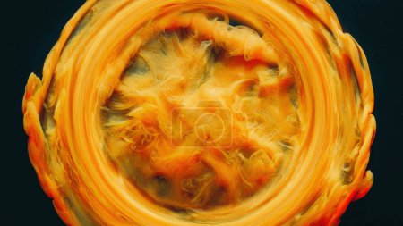 Photo for Smoke circle. Ink water. Fluid swirl. Fume vortex. Bright yellow orange red color vapor round frame splash on black abstract art background. - Royalty Free Image