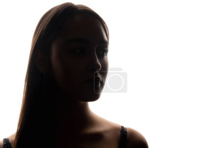 Photo for Beauty silhouette. Backlight portrait. Skincare model. Closeup of serious woman face shoulder outline on white empty space background. - Royalty Free Image