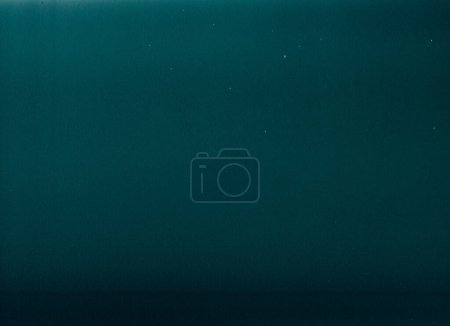 Photo for Old film. Grunge texture. Distressed overlay. Dust scratches particles on teal blue color faded worn abstract illustration copy space background. - Royalty Free Image