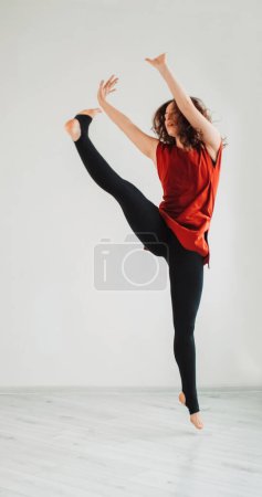 Photo for Ballerina dance. Sensual movements. Elegant jumping. Graceful creative artistic woman flying stretching body music moving in choreography studio. - Royalty Free Image