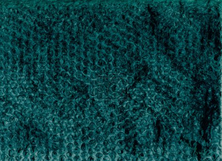 Photo for Grunge texture. Distressed bubble wrap. Gritty surface. Teal blue black color crumpled worn old plastic film on dark illustration abstract background. - Royalty Free Image