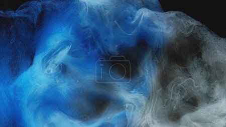 Photo for Color smoke puff. Ink water mix. Vapor splash. Blue gray fume cloud wave floating texture on dark black abstract art background. - Royalty Free Image