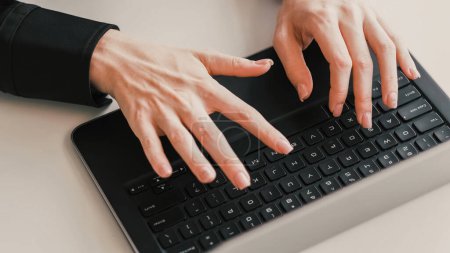 Photo for Searching information. Fast typing. Business lifestyle. Female woman hands pressing tapping on black computer keyboard browsing on light table. - Royalty Free Image