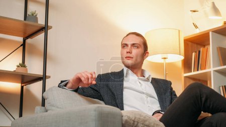 Photo for Successful people. Leadership ambition. Confident pensive business man on couch in light modern home living room interior copy space. - Royalty Free Image