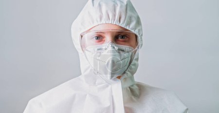 Air pollution. Protection equipment. Man made disaster. Environmental engineer scientist woman in ppe suit goggles glasses mask coverall isolated on grey background.