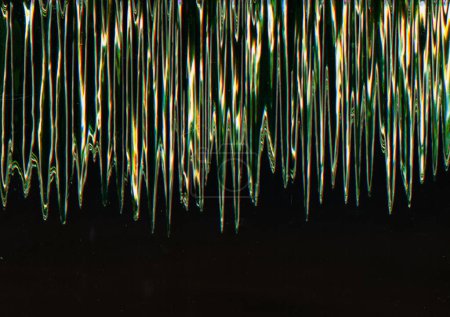 Photo for Digital glitch. Vibration noise. Signal distortion. Blurred glowing green zigzag lines interference frequency texture on black background. - Royalty Free Image